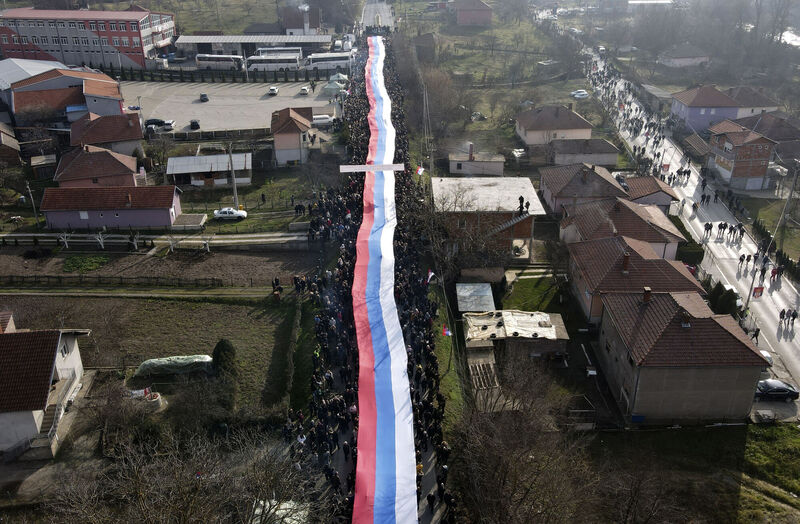 Kosovo Serbs carrying a giant Serbian flag during a protest near a barricade near Rudare village north of the Serb-dominated part of the ethnically divided town of Mitrovica, Kosovo, earlier this month. Picture: Bojan Slavkovic/AP Kosovo Serbs carrying a giant Serbian flag during a protest near a barricade near Rudare village north of the Serb-dominated part of the ethnically divided town of Mitrovica, Kosovo, earlier this month. Picture: Bojan Slavkovic/AP