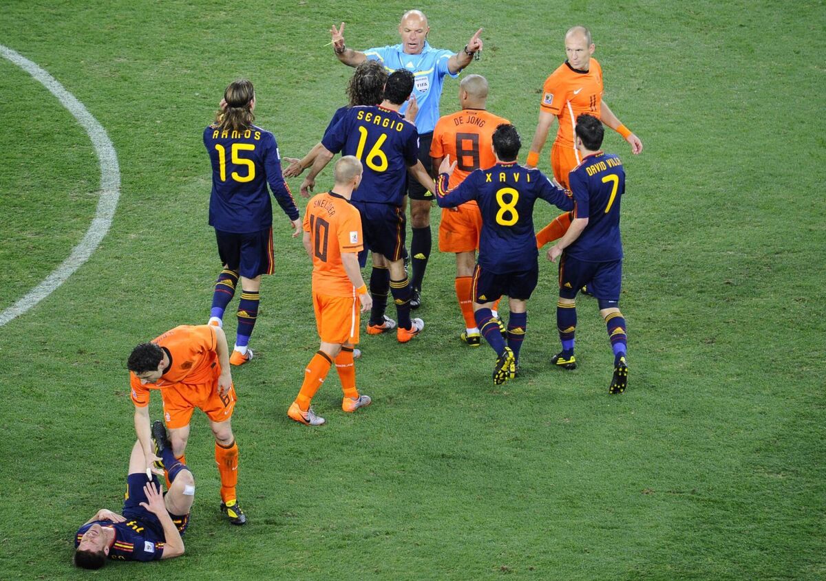 English referee Howard Webb gives a yellow card to Netherlands' midfielder Nigel de Jong (8) after a foul on Spain's midfielder Xabi Alonso in the 2010 World Cup final. Picture: STEPHANE DE SAKUTIN/AFP via Getty Images