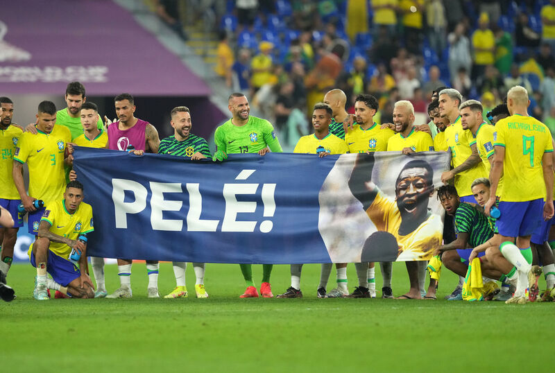 HERO: Brazil players bring a Pele banner on to the pitch following the FIFA World Cup Round of Sixteen match at Stadium 974 in Doha, Qatar. Pic: Martin Rickett/PA Wire HERO: Brazil players bring a Pele banner on to the pitch following the FIFA World Cup Round of Sixteen match at Stadium 974 in Doha, Qatar. Pic: Martin Rickett/PA Wire