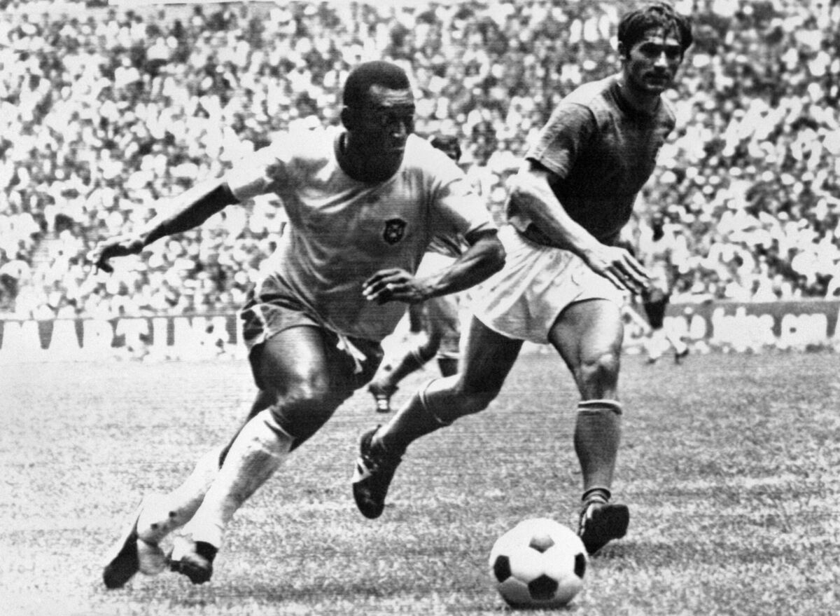 Pele dribbles past Italian defender Tarcisio Burgnich in the 1970 World Cup final in Mexico. He scored the opener as Brazil went on to beat Italy 4-1 to capture its third World Cup 