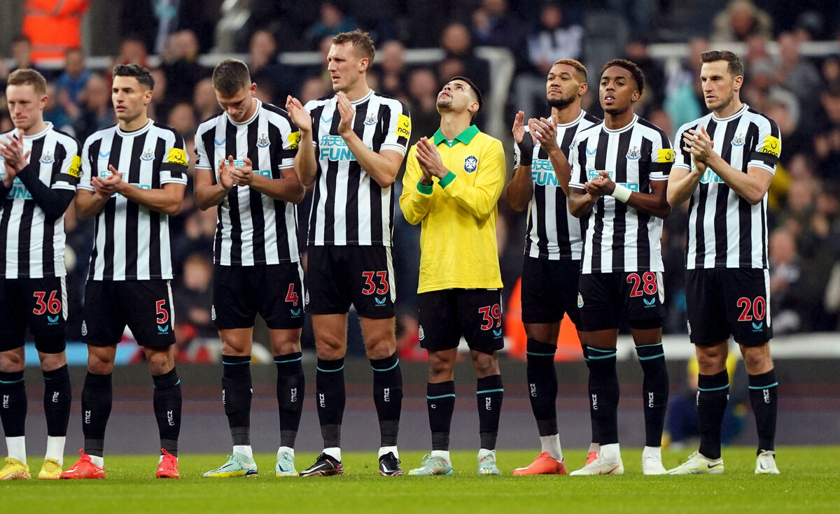 Newcastle United's Bruno Guimaraes wearing a Brazil shirt alongside team mates as they stand for a minute's applause in tribute to Pele. Picture: Owen Humphreys/PA Wire.