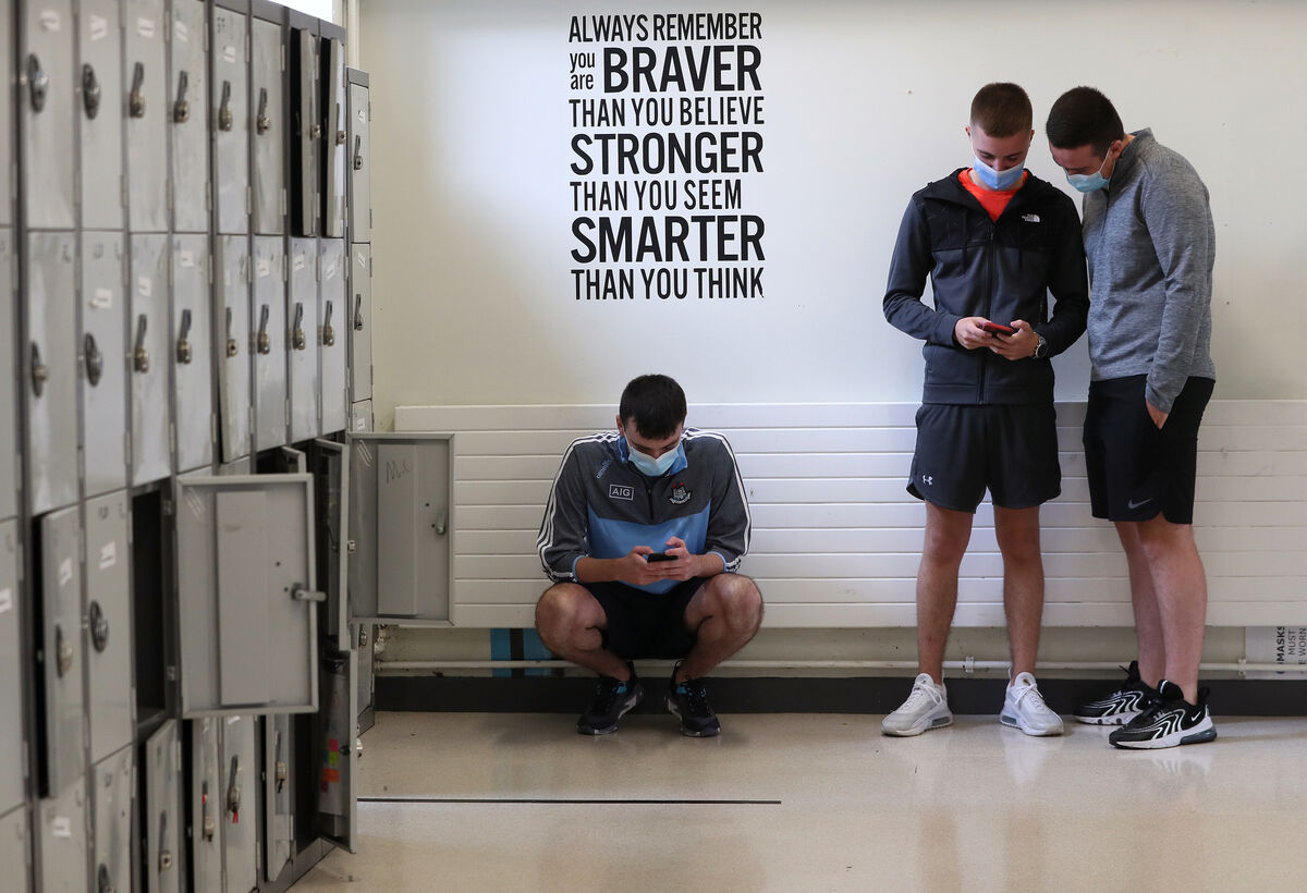 Past pupils of Beneavin De La Salle College, Finglas, Luke Norton (left) Brandyn Smullen (centre) and Lee Browning, check their results at the school as more than 61,000 students have received Leaving Cert results nationwide which show that grades jumped to another record high. Picture date: Friday September 3, 2021.