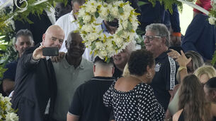 <p>Fifa president Gianni Infantino further disgraced himself, if that were possible, by taking selfies during the wake in Brazil for the great Pelé. Picture: André Penner/AP</p>