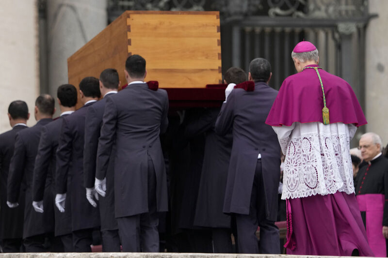 Archbishop Georg Ganswein, right, follows the coffin of late Pope Emeritus Benedict XVI as it is carried away after a funeral mass in St Peter's Square at the Vatican, Picture: Andrew Medichini
