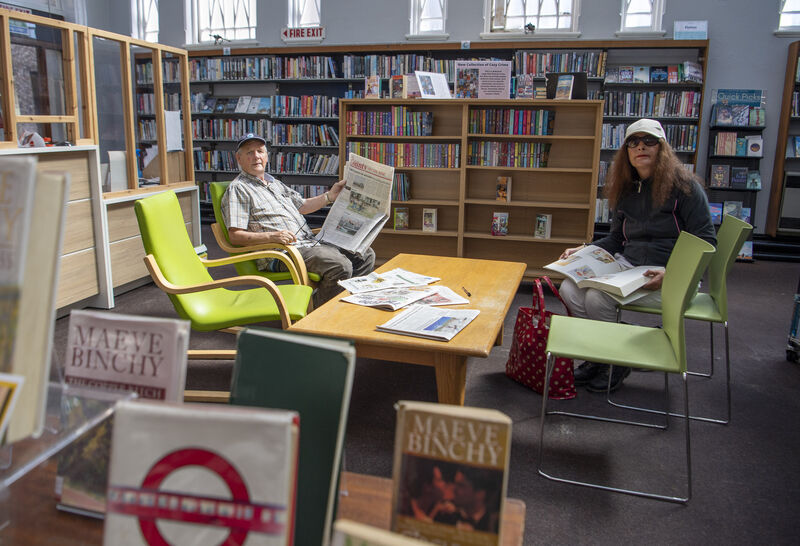 Noel Long and Rosaleen O'Rourke catching up on the news at Cork City Library.