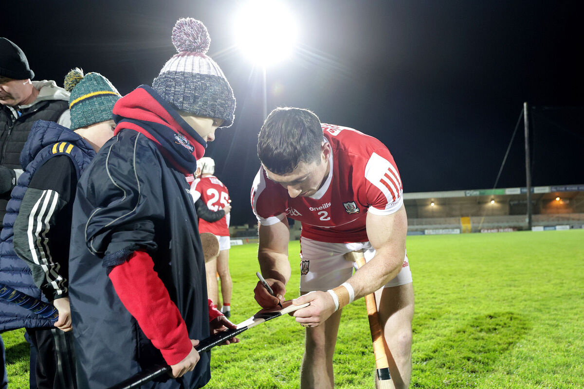 DOTTED LINE:  Cork's Sean O’Donoghue signs an autograph after the game. Picture: INPHO/Laszlo Geczo