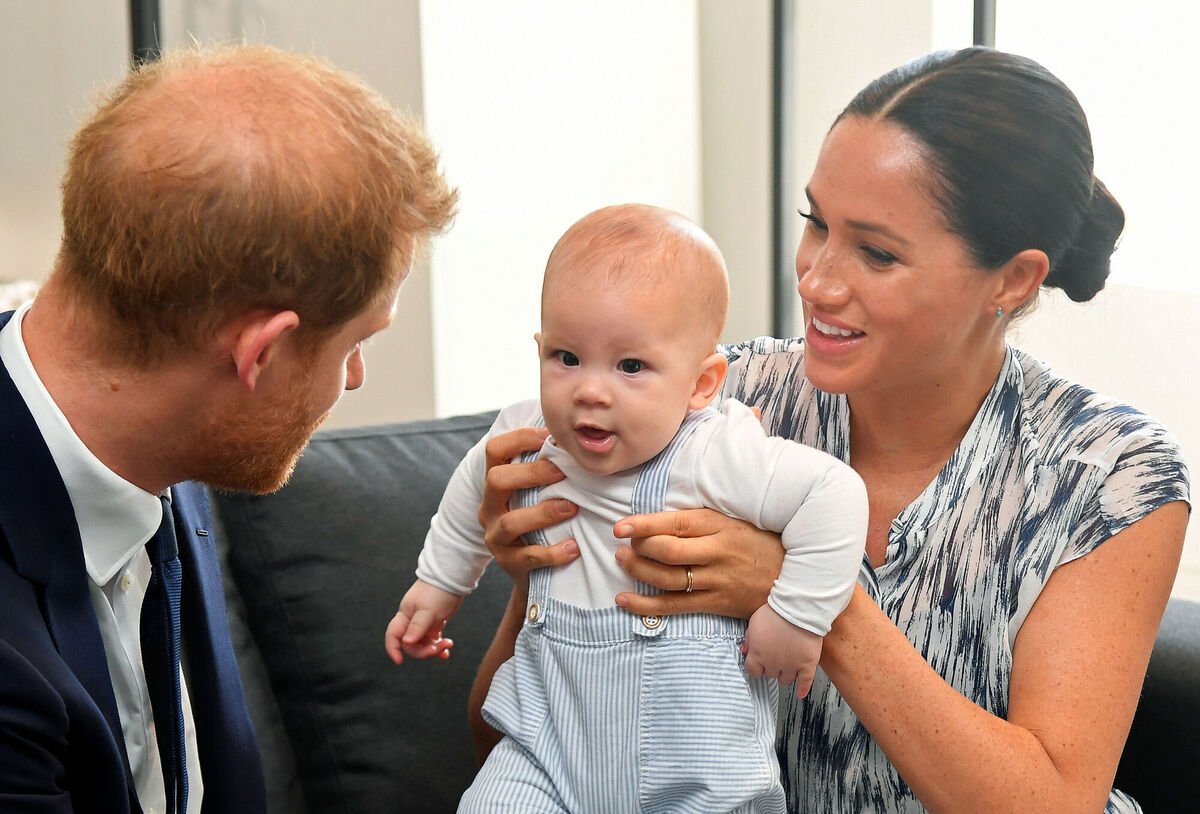Harry and Meghan holding their son Archie. Picture: Dominic Lipinski/PA Wire