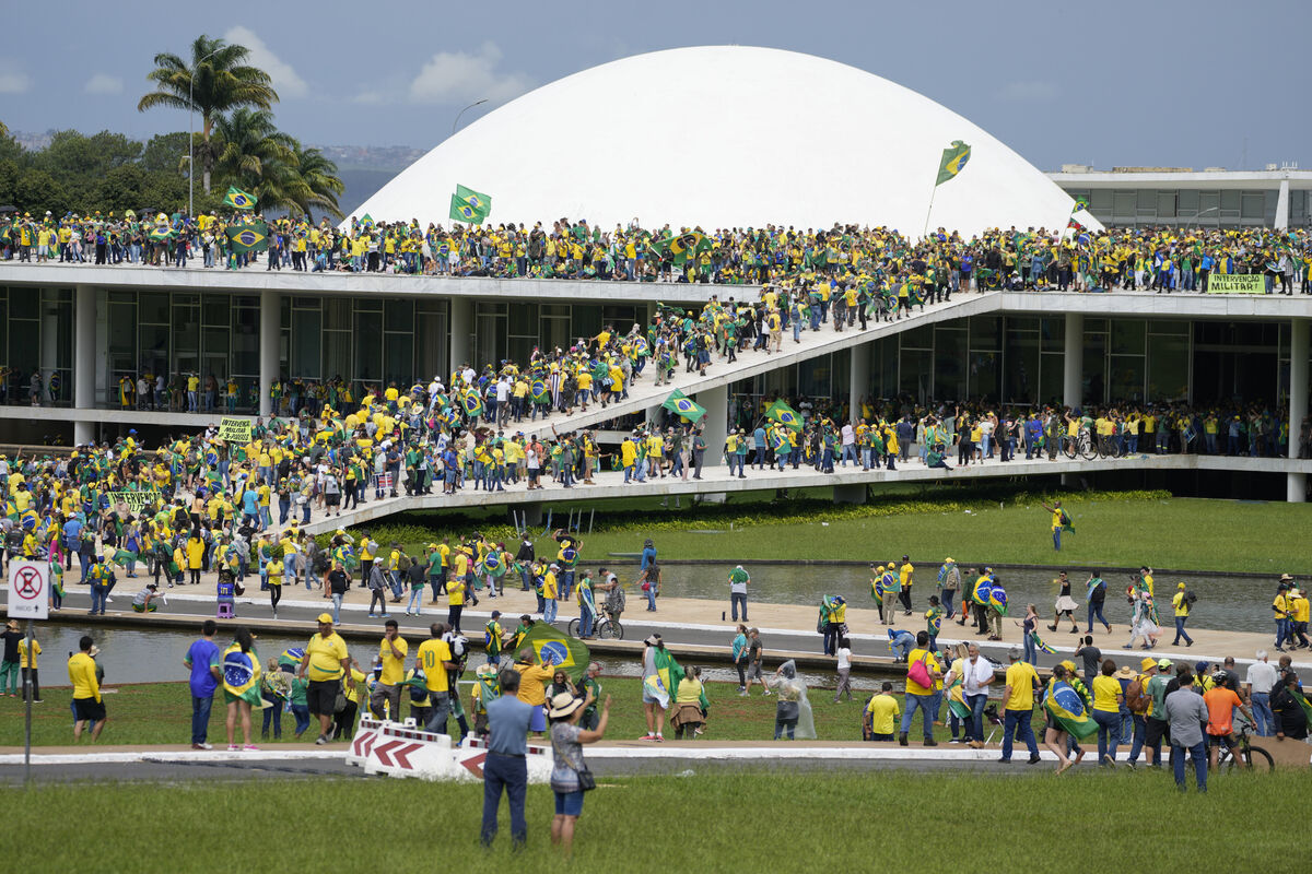 Bolsonaro supporters storm the the National Congress building in Brasilia on Sunday. Picture: AP Photo/Eraldo Peres