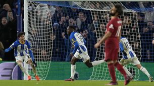 <p>CLINCHER: Brighton's Danny Welbeck, center, celebrates after scoring his side's third goal during the Premier League match against Liverpool at the Falmer Stadium in Brighton. Pic: AP Photo/Frank Augstein</p>