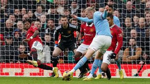 <p>CLOSE ATTENTION: Manchester City's Erling Haaland see's his shot blocked by Manchester United's Fred (left) during the Premier League match at Old Trafford, Manchester. Pic: Martin Rickett/PA Wire</p>