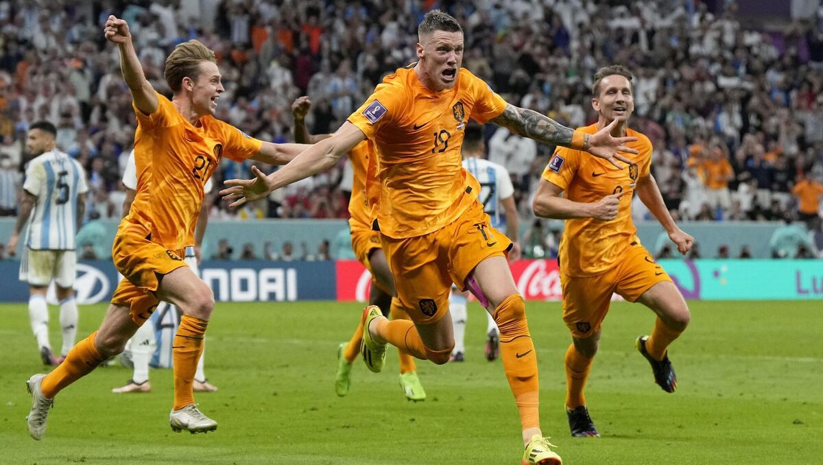 Wout Weghorst of the Netherlands, center, celebrates after scoring his side's second goal during the World Cup quarterfinal soccer match between the Netherlands and Argentina, at the Lusail Stadium in Lusail, Qatar, Saturday, Dec. 10, 2022. (AP Photo/Ricardo Mazalan)