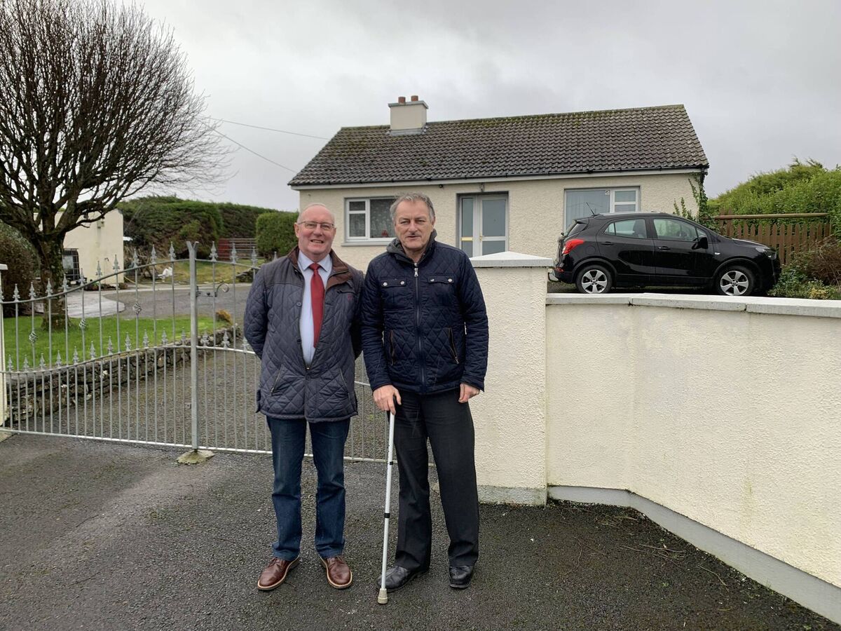 James McLoughlin, left, treasurer of Skreen Dromard Community Council and Michael Walsh, cousin of Tom Niland outside Toms home at Doonflynn, Skreen, Co Sligo. 