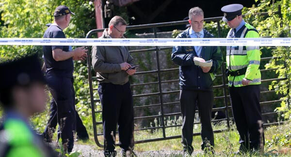 Gardai at the scene at a derelict house and farmyard on the Clonee Road, Lucan. Picture: Collins