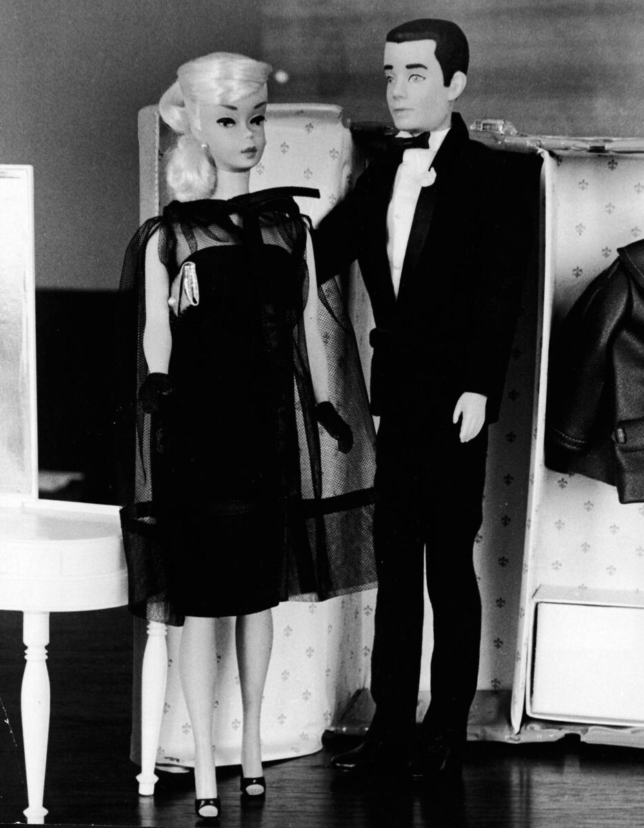 Two children's dolls, Barbie and Ken, in formal wear, stand together in front of a toy closet, December 15, 1964. Picture: Express Newspapers/Getty Images Two children's dolls, Barbie and Ken, in formal wear, stand together in front of a toy closet, December 15, 1964. Picture: Express Newspapers/Getty Images
