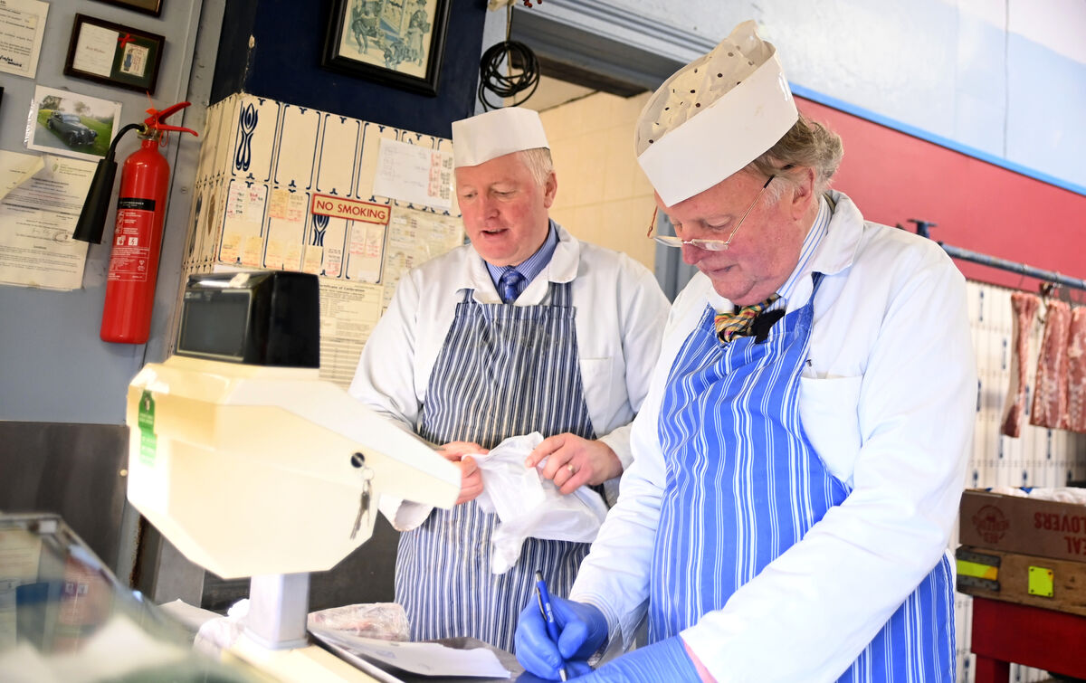 Weighing up: Patrick O’Flynn and Tom Collins at the scales at 36 Marlboro Street. Pic: Larry Cummins 