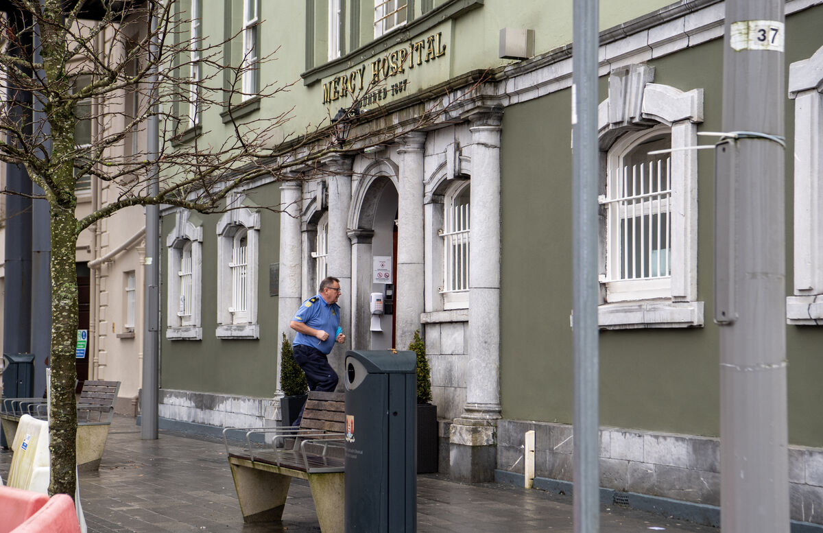 A Garda member entering the Mercy Hospital, Cork, where an elderly man was attacked on a ward and subsequently died. Picture: Dan Linehan