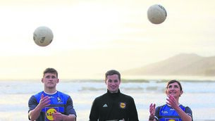 <p>INCHING CLOSER: Kerry footballers Cáit Lynch and Gavin White with Comórtas chairman Pádraig Óg Ó Sé on Inch Beach for the launch of the Lidl Comórtas Peile Páidí Ó Sé, which takes place from February 24-26.</p>