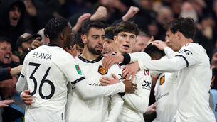 <p>ONE FOOT:Manchester United's Bruno Fernandes celebrates scoring his sides third goal with team mates during the Carabao Cup semi-final.</p>