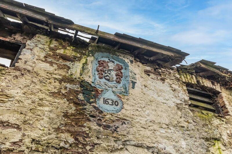 Old dairy building with crest recalling 17th century origins Old dairy building with crest recalling 17th century origins