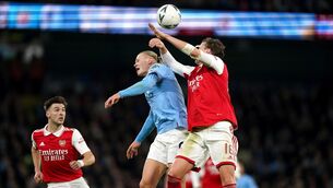 <p>UP FOR IT: Manchester City's Erling Haaland (left) is clattered by Arsenal's Rob Holding during the Emirates FA Cup fourth round match at Etihad Stadium, Manchester. Pic: Mike Egerton/PA Wire</p>