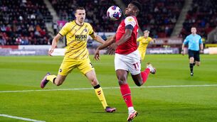 <p>SUCCESS: Rotherham United's Chiedozie Ogbene (right) and Millwall's Murray Wallace. Pic: Danny Lawson/PA Wire.</p>