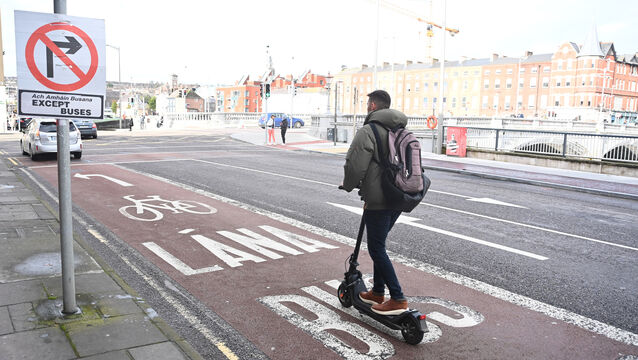 At least this e-scooter user opted for the bus lane rather than the footpath. Picture: Larry Cummins <p> At least this e-scooter user opted for the bus lane rather than the footpath. Picture: Larry Cummins</p>