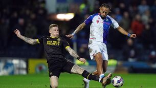<p>TOUGH TACKLING: Wigan Athletic's James McClean and Blackburn Rovers' Sorba Thomas (right) battle for the ball during the Sky Bet Championship match at Ewood Park, Blackburn. Pic: Mike Egerton/PA Wire</p>