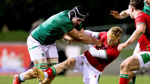 <p>MORE OF THE SAME, PLEASE: Ireland's Ruadhan Quinn is tackled by Harri Houston of Wales. Pic: ©INPHO/Tom Maher</p>