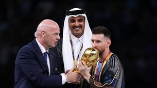 <p>Lionel Messi with the World Cup alongside FIFA chief Gianni Infantino and Sheikh Tamim bin Hamad Al Thani, Emir of Qatar</p>