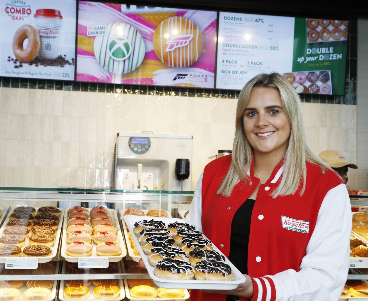 Katie Byrne, Krispy Kreme staff member, with a tray of the US firm's products in one of the 18 new outlets it is to open across Ireland.
