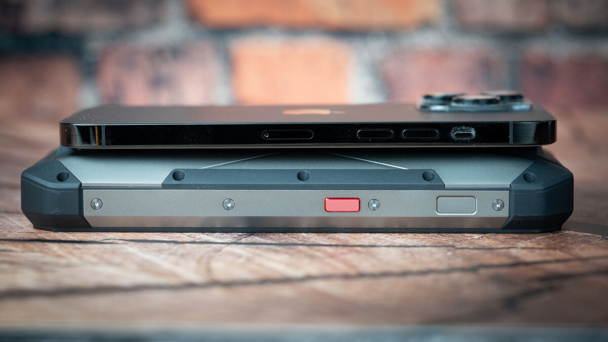 The Unihertz Tank with iPhone 14 Pro Max onto for size comparison. Picture: Noel Campion.