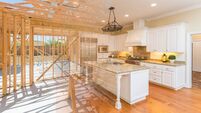 House Construction Framing Gradating Into Finished Kitchen Build