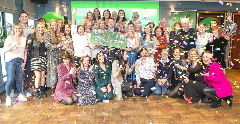 The ‘Seomra 22’ syndicate holding the winning cheque. Picture: Gerard McCarthy / Mac Innes Photography