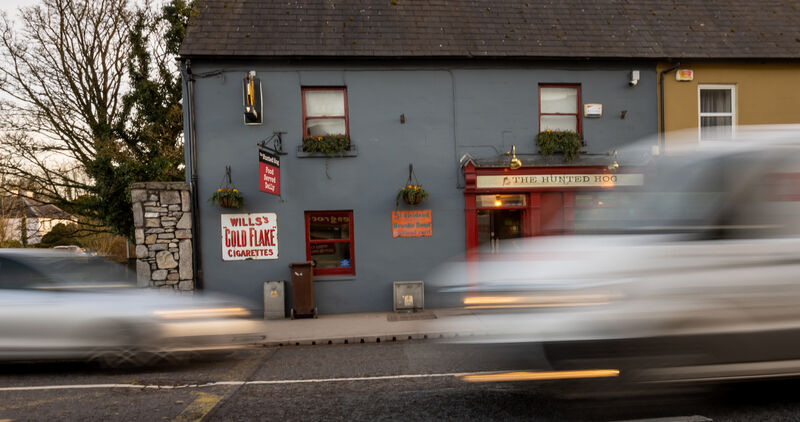 Traffic hurtling past the Hunted Hog pub on Main St, Castlemartyr. Speed is a big issue, says Orla McGovern, who sees some cars going so fast over the hump-back bridge across the Kiltha that they literally leave the road. Picture: Neil Michael