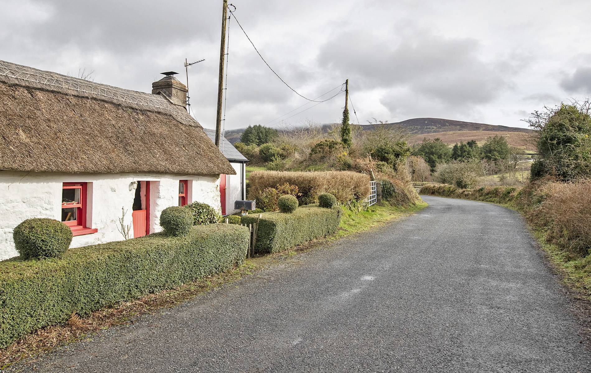 Buy your Valentine 'Rose's Cottage' - the tiny thatch love-nest is a smoking hot snip at €139k