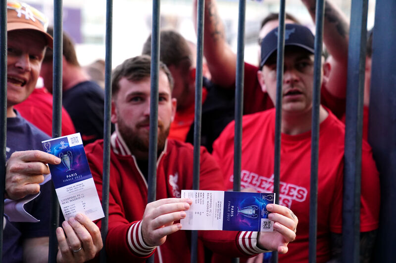 Liverpool fans stuck outside the ground show their match tickets during the UEFA Champions League Final at the Stade de France, Paris. Picture: Adam Peck Liverpool fans stuck outside the ground show their match tickets during the UEFA Champions League Final at the Stade de France, Paris. Picture: Adam Peck