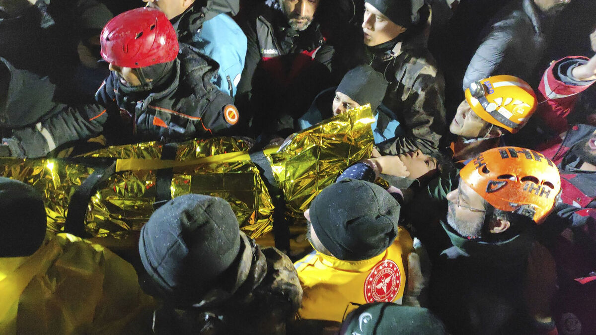 Rescue workers and medics carry a young woman they have rescued from the debris of a collapsed building in Sanliurfa, southern Turkey, on February 6, 2023. Picture: AP