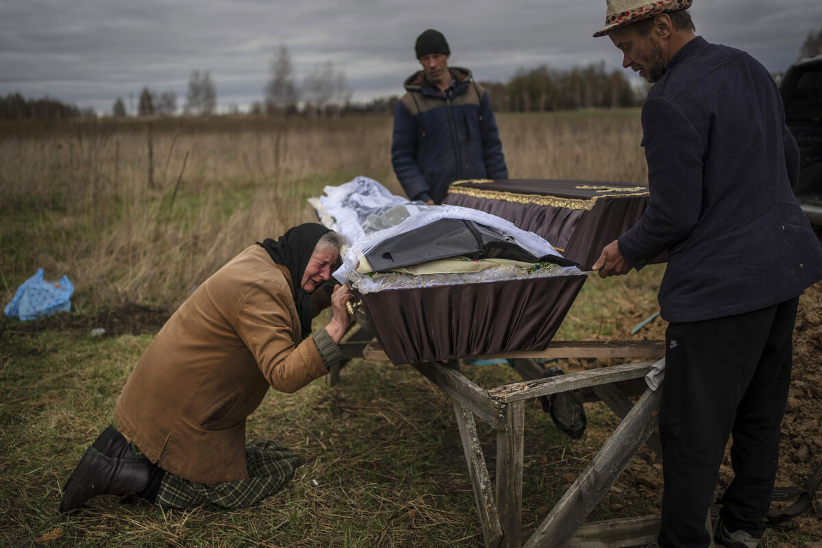 Nadiya Trubchaninova cries over the coffin of her son, Vadym, who was killed on March 30 by Russian soldiers in Bucha. Picture: AP/Rodrigo Abd Nadiya Trubchaninova cries over the coffin of her son, Vadym, who was killed on March 30 by Russian soldiers in Bucha. Picture: AP/Rodrigo Abd