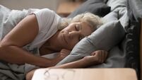 Calm peaceful healthy elderly woman enjoying sleeping recovery