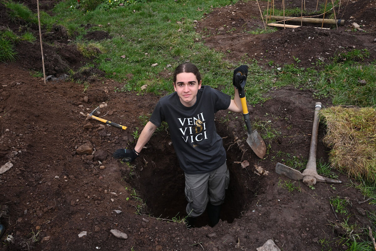 Cosimo De Matteis, from Italy, digs a test hole in preparation for making a pond He is working at the garden at Clashduv Road, Togher while attending school at Coláiste Éamann Rís, Deerpark. Picture: Larry Cummins