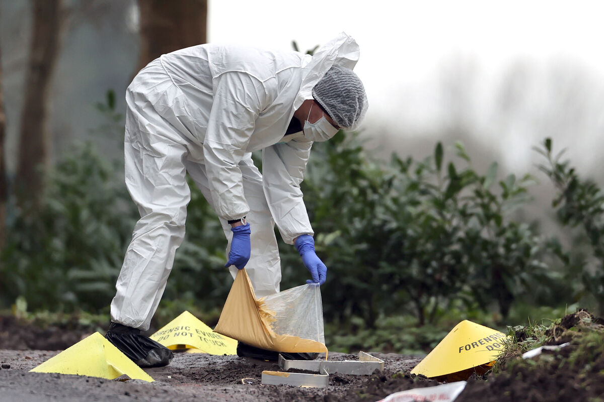 A forensic officer making a mould at the scene near the sports complex in the Killyclogher Road area of Omagh, Co Tyrone, where off-duty PSNI Detective Chief Inspector John Caldwell was shot a number of times by masked men in front of young people he had been coaching. Mr Caldwell remains in a critical but stable condition in hospital following the attack on Wednesday evening. Picture date: Thursday February 23, 2023.