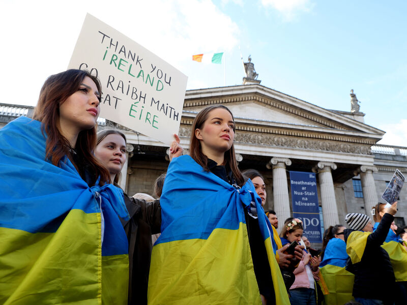  People from Ukraine and their Irish supporters listen to Tánaiste Micheál Martin addressing the rally on O'Connell St in Dublin. Picture: Sam Boal/RollingNews