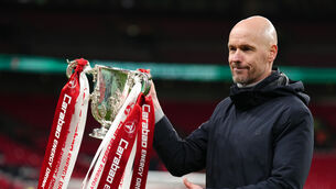 <p>FIRST OF MANY? Manchester United manager Erik ten Hag lifts the trophy after winning the Carabao Cup Final match at Wembley Stadium.</p>