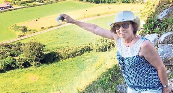 Ellen McCourt scattering Frank’s ashes at Carrigogunnell Castle. Ellen McCourt scattering Frank’s ashes at Carrigogunnell Castle.