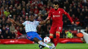 <p>RIVALRY RENEWED: Mohamed Salah of Liverpool scores his side's fourth goal whilst under pressure from Aaron Wan-Bissaka of Manchester United during their last meeting at Anfield. Pic Credit: Clive Brunskill/Getty Images.</p>