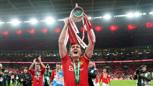 <p>SKIPPER: Manchester United's Harry Maguire lifts the trophy after the Carabao Cup Final.</p>