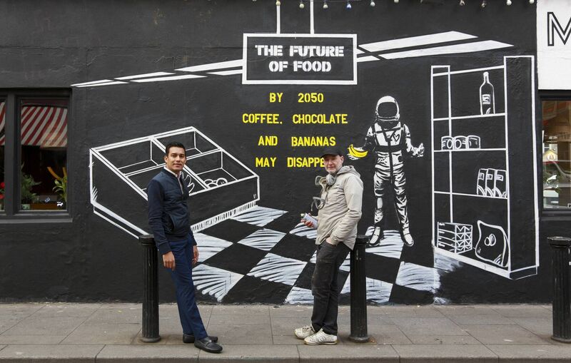 Jose Daniel Aguilar, coffee producer from Honduras, and street artist Shane Sutton at a new mural in Dublin to highlight the risks to our food due to climate change. Picture: Karen Morgan