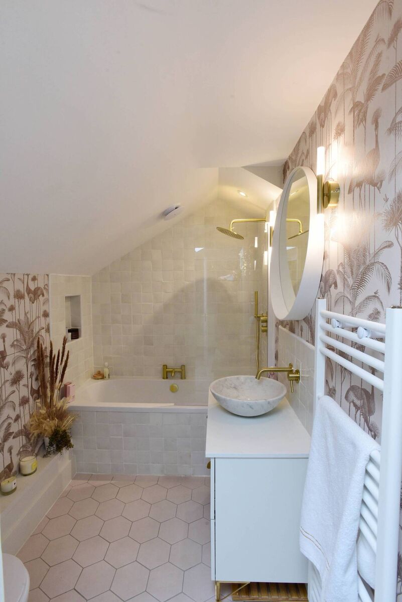 Vertical radiators take up less space, as seen in the upstairs bathrrom in Jennifer's home. Picture: Moya Nolan