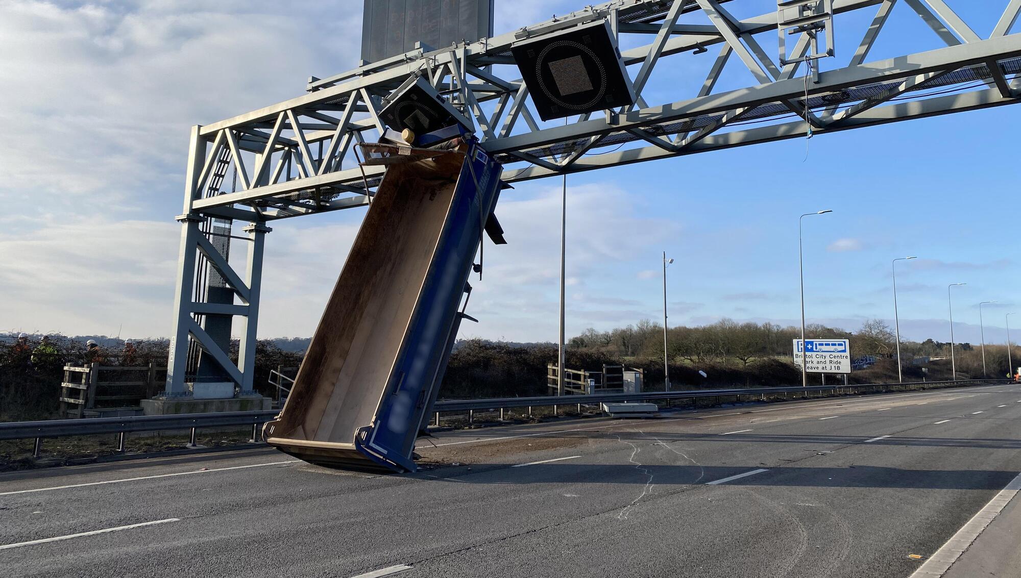 Motorway closed after truck hits overhead gantry in England