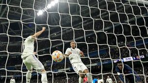 <p>EDER ERROR: Real Madrid's Brazilian defender Eder Militao (centre) reacts after scoring an own-goal under pressure from Barcelona's Ivorian midfielder Franck Kessie in the Copa del Rey semi-final first leg at the Bernabeu Stadium in Madrid. Pic credit: Javier Soriano/AFP via Getty Images</p>